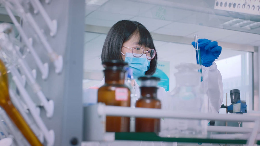 Laboratory technician testing ingredients for RoyalHugge products